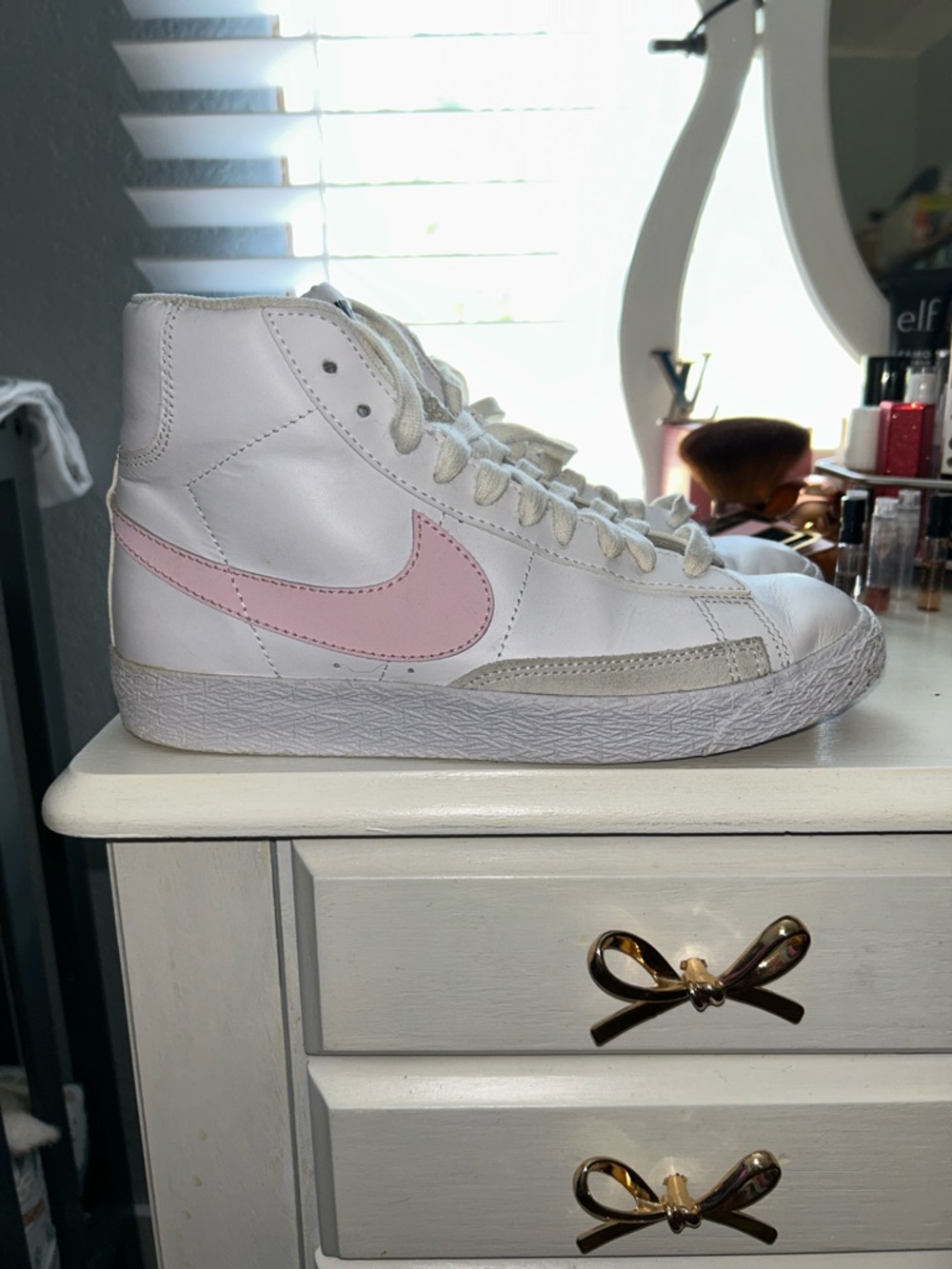Nike White High-Top Sneakers with Pink Swoosh